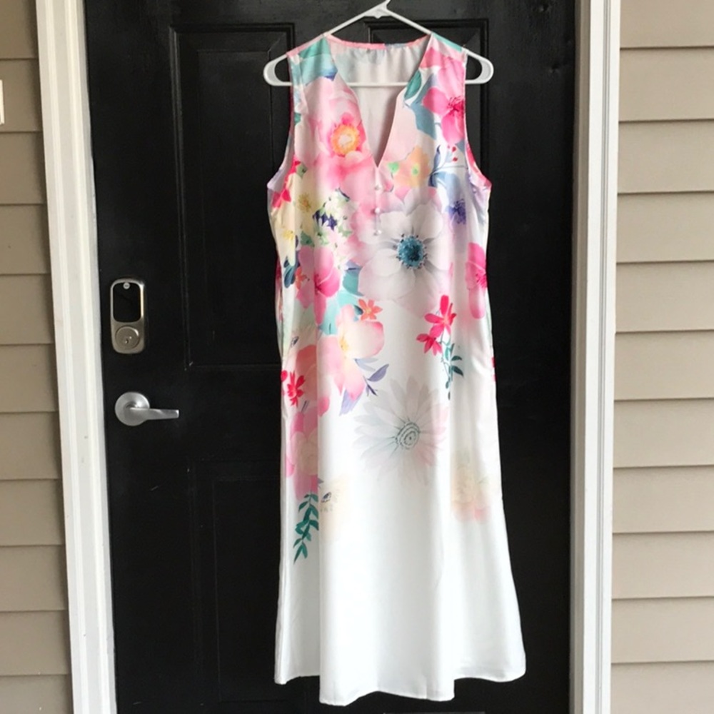 Celebrate Easter in this beautiful white dress with pastel flowers.